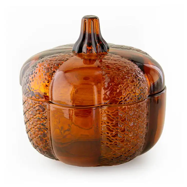 Glass pumpkin with textured surface on a white background